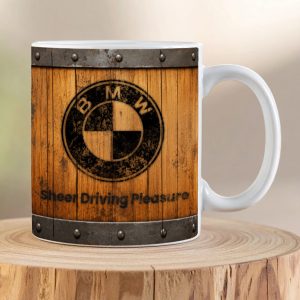 BMW Vintage Timber ceramic coffee mug featuring the BMW roundel on a rustic wooden garage sign background with the slogan “Sheer Driving Pleasure”.